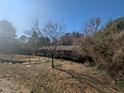 A cozy single-story home with mature trees and a serene front yard at 3501 Turnbridge Dr, Raleigh, NC 27609