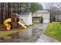 The backyard features a playground set, detached shed, and a patio at 4102 Panther Creek Pkwy, Durham, NC 27704