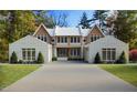 Beautifully rendered new home with white brick and mature trees at 4305 Windsor Pl, Raleigh, NC 27609