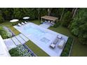 Aerial view of a backyard featuring a modern pool and outdoor seating area at 4305 Windsor Pl, Raleigh, NC 27609
