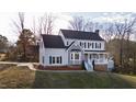 Traditional two-story home boasts a symmetrical facade and a beautifully landscaped front yard at 6309 Charmco Ct, Wake Forest, NC 27587