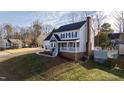 Attractive home featuring a covered front porch, neutral siding, and a neatly manicured lawn at 6309 Charmco Ct, Wake Forest, NC 27587
