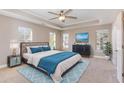 Tranquil main bedroom featuring tray ceiling, a plush bed and calming color palette at 89 Bison Ln, Lillington, NC 27546
