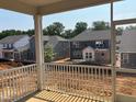 View from the screen back porch showing new houses under construction in the neighborhood at 97 Willow Cameron Way, Angier, NC 27501