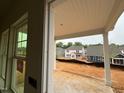 View of the neighborhood from the covered patio showing new home construction at 97 Willow Cameron Way, Angier, NC 27501