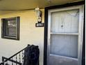 Close-up of an entryway with a security camera, showcasing the address and door details at 107 Creel St, Chapel Hill, NC 27516