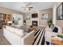 Bright living room featuring a fireplace, modern furnishings, and stylish decor at 109 Somerset Farm Dr, Holly Springs, NC 27540