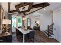 Charming dining room showcasing a decorative ceiling, wood floors and abundant natural light at 1964 Old Byre Way, Apex, NC 27502