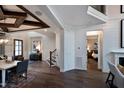 Open foyer featuring wood floors, shiplap wall, and entry to bedroom at 1964 Old Byre Way, Apex, NC 27502