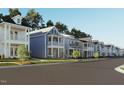 A view of the street with the beautiful single Gathering homes on a sunny day at 272 White Oak Garden Way # 209, Garner, NC 27529