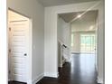 Inviting entryway with hardwood floors and neutral paint, leading to a bright living space at 456 Barbour Farm Ln, Four Oaks, NC 27524