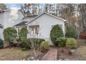 Inviting home with a brick walkway and well-maintained landscaping at 482 Beechmast, Pittsboro, NC 27312