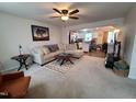 Inviting living room seamlessly flowing into an open-concept kitchen, great for entertaining at 5943 River Landings Dr, Raleigh, NC 27616