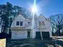 Two-story home under construction with a partially installed roof and covered with Dream Finder Homes wrap at 744 Portland Rose Dr, Knightdale, NC 27545