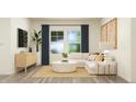 Inviting living room with a white sectional, wood floors, and natural light streaming through large windows at 77 Sunshine Rd # 3, Kenly, NC 27542