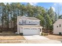 Charming two-story home featuring a spacious two-car garage and a well-maintained front yard at 912 Obsidian Way, Durham, NC 27703