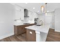 Bright, modern kitchen featuring white cabinets, stainless steel appliances, and a spacious island at 913 Myers Point Dr, Morrisville, NC 27560