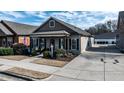 Exterior view of the house and driveway on a sunny day at 103 Bella Sq Sq, Smithfield, NC 27577
