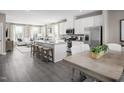 Modern kitchen with white cabinets, gray countertops, stainless steel appliances, and an island at 1404 Chowan Ave, Durham, NC 27713