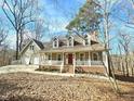 Beautiful home with a covered front porch and inviting curb appeal at 2024 Fox Den, Clayton, NC 27527
