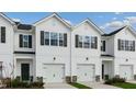 Inviting townhome exteriors with well-manicured lawns and single car garages at 208 Starlight St, Sanford, NC 27330