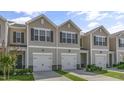 Charming two-story tan townhome with a single-car garage and manicured lawn at 216 Starlight St, Sanford, NC 27330