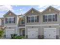 Attractive townhomes with individual single-car garages and pleasant landscaping at 216 Starlight St, Sanford, NC 27330
