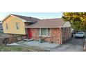 Traditional two-story home with brick and siding exterior, complemented by a well-maintained yard and paved driveway at 2201 Valiant St, Raleigh, NC 27610