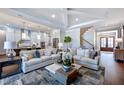 An open-concept living room filled with modern decor and lots of natural light at 223 Harvester Rd, Angier, NC 27501
