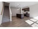 Open-concept kitchen with island, stainless steel appliances, and modern finishes at 260 Chesapeake Commons St # 156, Garner, NC 27529