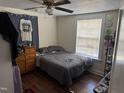 Simple bedroom with hardwood floors and a ceiling fan, providing a comfortable and functional space at 3117 Cheek Rd, Durham, NC 27704