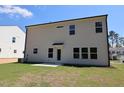 A newly constructed home featuring a spacious backyard with a small patio, perfect for outdoor entertaining at 1229 Dimaggio Dr # 8, Raleigh, NC 27616