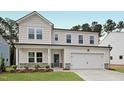 Charming two-story home with white siding, stone accents and a two car garage at 1229 Dimaggio Dr # 8, Raleigh, NC 27616