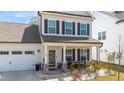 Inviting front porch with seating and decorative touches, offering a cozy entrance to the home at 1311 Arena Ln, Fuquay Varina, NC 27526