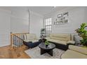 Cozy living room with hardwood floors, modern furniture, and stylish decor at 1403 Medici Ct, Cary, NC 27518