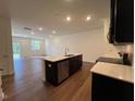 Gourmet kitchen island has a sink, stainless steel appliances, and bar seating at 144 Parker Ln, Mebane, NC 27302