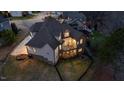 Aerial view of backyard featuring deck, patio, landscaping, and fenced lawn at 2933 Elmfield St, Raleigh, NC 27614