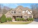 Traditional home boasting stone and siding exterior, with a well-kept front yard at 2933 Elmfield St, Raleigh, NC 27614