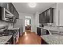 Modern kitchen features stainless steel appliances and granite countertops at 372 Lynshire Ave, Clayton, NC 27527