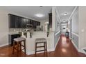 Eat-in kitchen showcases stainless steel appliances, granite countertops, and a breakfast bar at 372 Lynshire Ave, Clayton, NC 27527