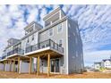 Rear exterior view of townhouse with a deck and siding at 509 Sherron Rd # 25, Durham, NC 27703