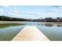 Scenic view of a tranquil pond, perfect for peaceful reflections and enjoying nature's beauty at 6480 Union Ridge Rd, Burlington, NC 27217