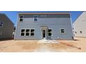 The back of the two story home has light blue horizontal siding and many windows at 1240 Dimaggio Dr # 35, Raleigh, NC 27616