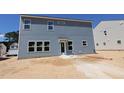The back of the two story home has light blue horizontal siding and many windows at 1240 Dimaggio Dr # 35, Raleigh, NC 27616