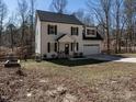 Charming two-story home featuring a paved driveway and a well-maintained front lawn at 2218 Christian Light Rd, Fuquay Varina, NC 27526