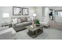 Comfortable living room with a neutral color scheme and stylish decor at 429 Grand Silo Rd, Raleigh, NC 27603