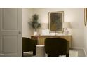 Cozy home office with sleek desk setup, decorative lamps, and comfortable chairs at 532 Morning Light Dr, Angier, NC 27501