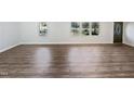Spacious living room with hardwood floors and lots of natural light at 6423 Whitt Rd, Durham, NC 27712