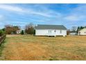 Expansive backyard with green grass, ready for outdoor activities and relaxation at 104 Eddy Ct, Benson, NC 27504