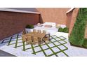 A backyard dining and lounge area featuring stone pavers, and manicured plantings at 1612 Hunting Ridge Rd, Raleigh, NC 27615